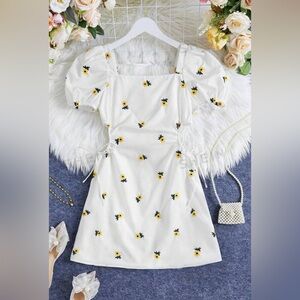 White dress, yellow flowers,princess sleeves